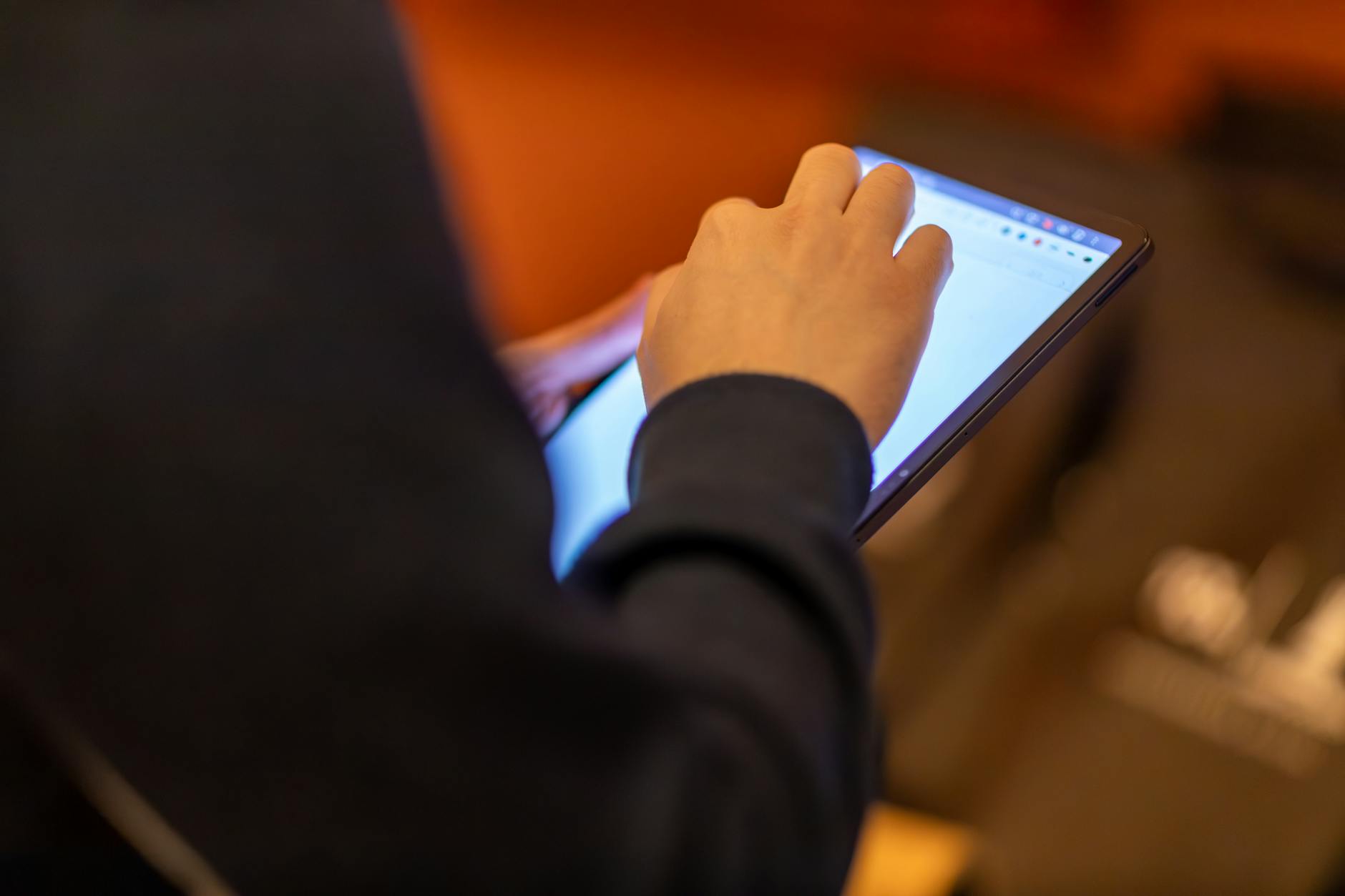a person holding a tablet